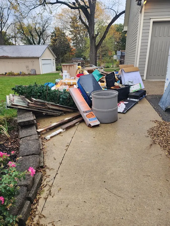 Dumpster being loaded with debris for 3 Yard Dumpster Rental in Mount Holly